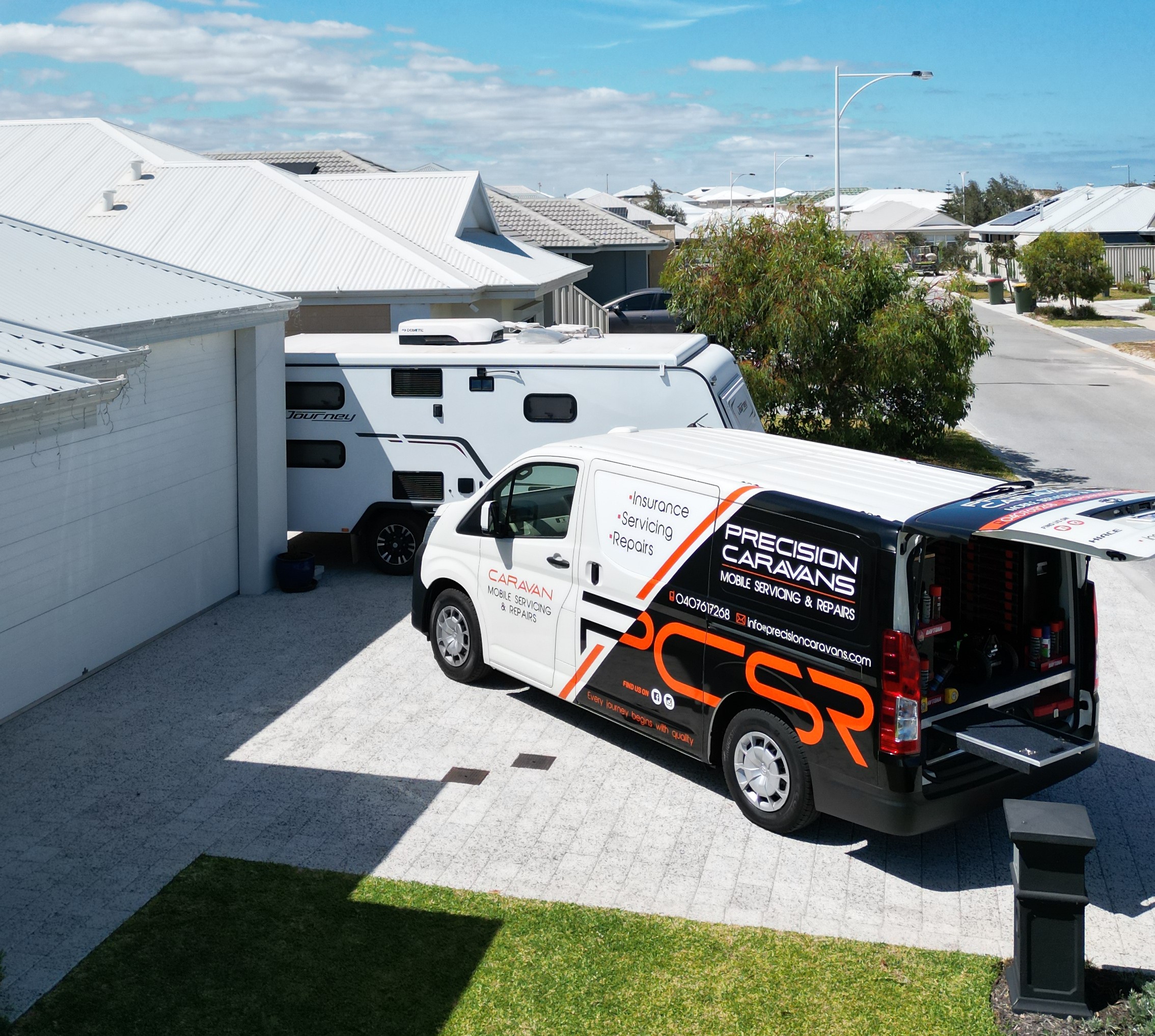 Precision Caravans mobile service van parked at customer's driveway in Perth, ready to service caravan on-site